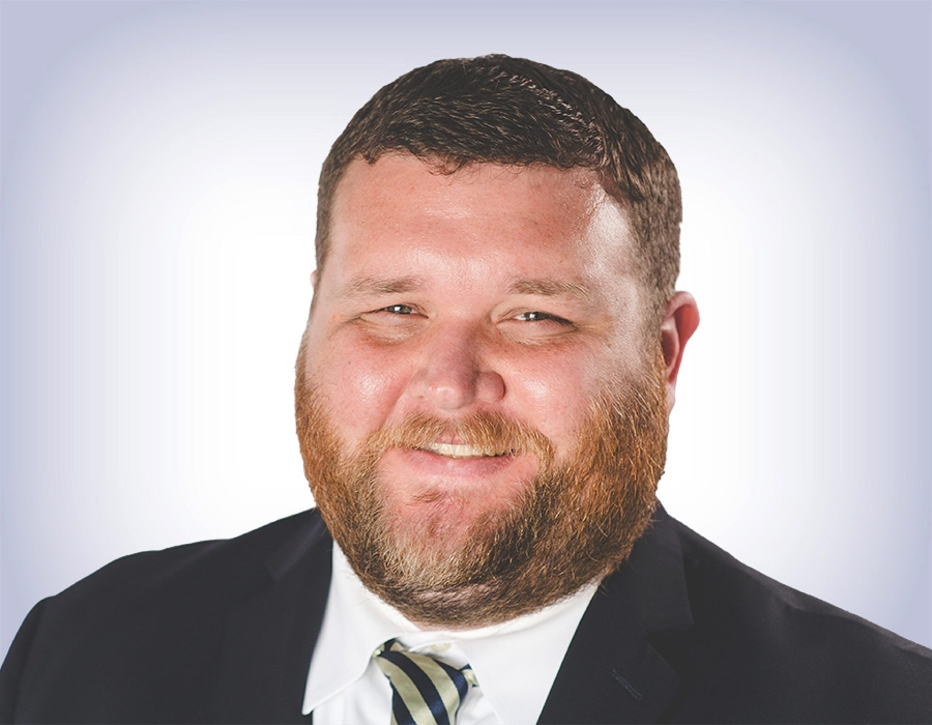 Headshot of Calvin Baker on white background