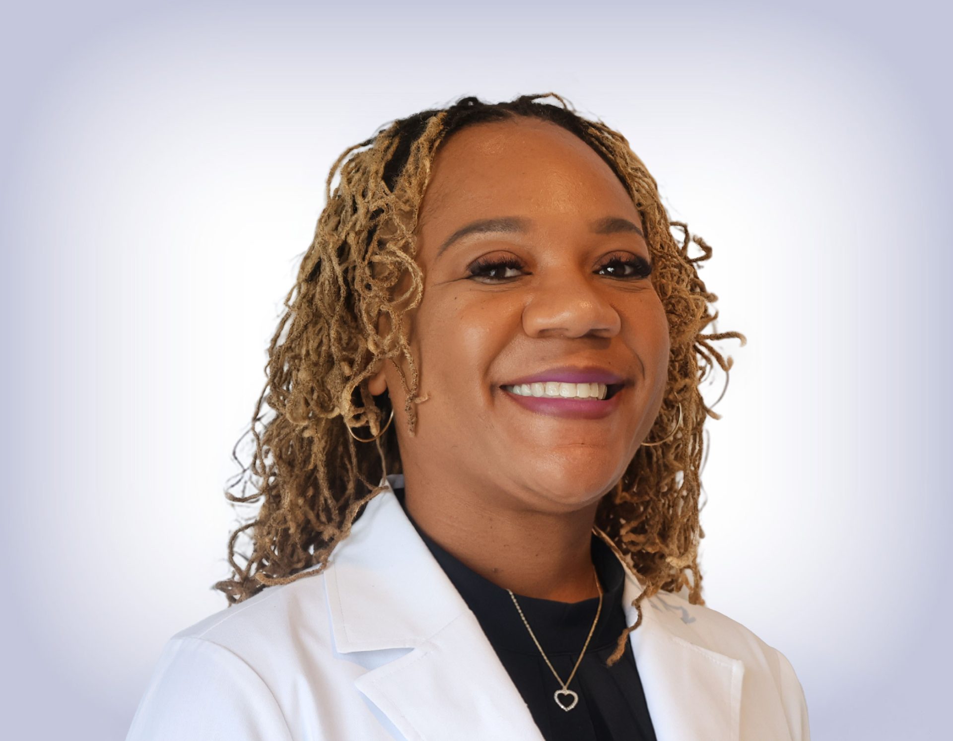 Headshot of Jamesha tumblin on white background