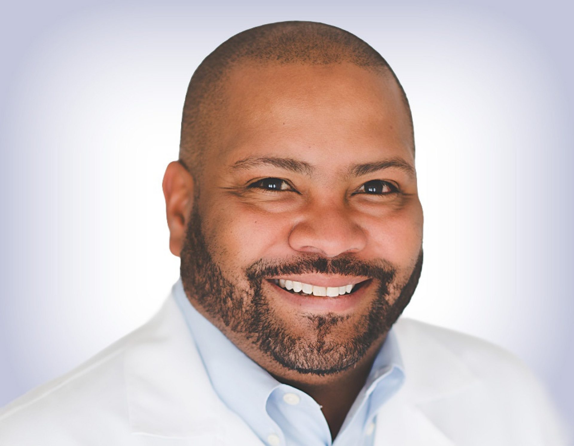 Headshot of marcus britton on white background