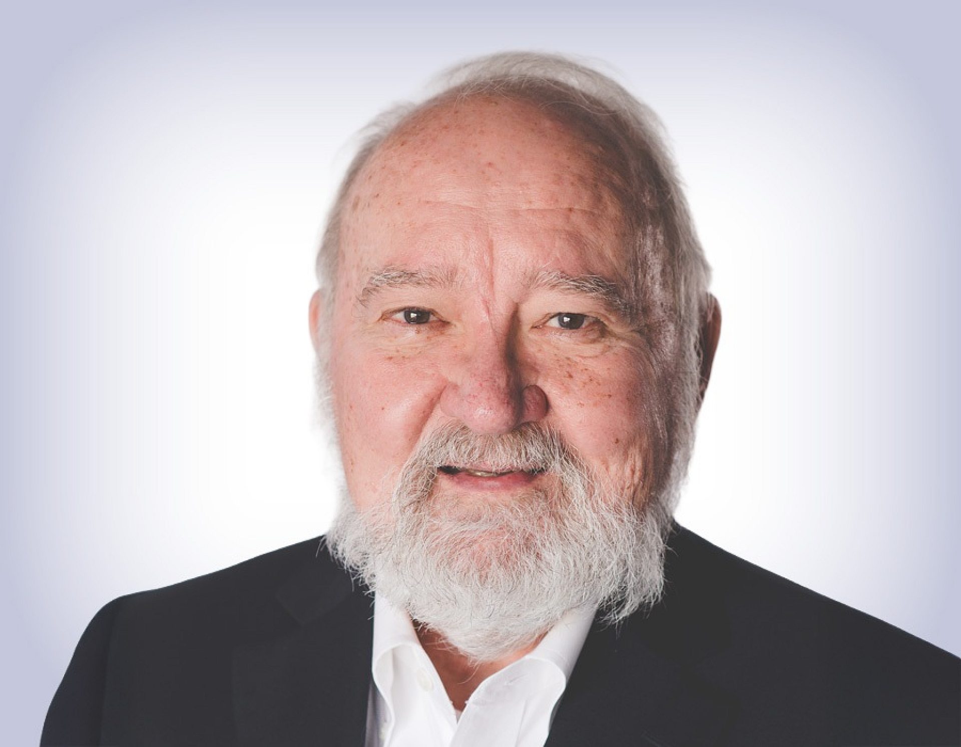 Headshot of tom woolridge on white background